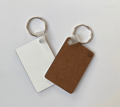 100 x MDF Sublimation Keyrings Rectangle 6cm x 4cm Single Sided - sublimania.com - Muglamania Limited