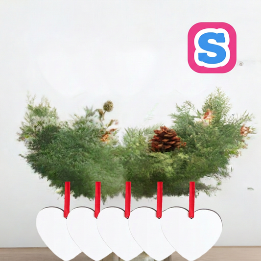 Five white heart-shaped MDF sublimation Christmas baubles with red ribbons and Sublimania S logo in a festive setting