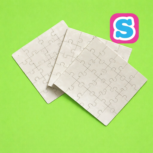 Three overlapping white MDF sublimation jigsaw puzzles with Sublimania S logo on green background