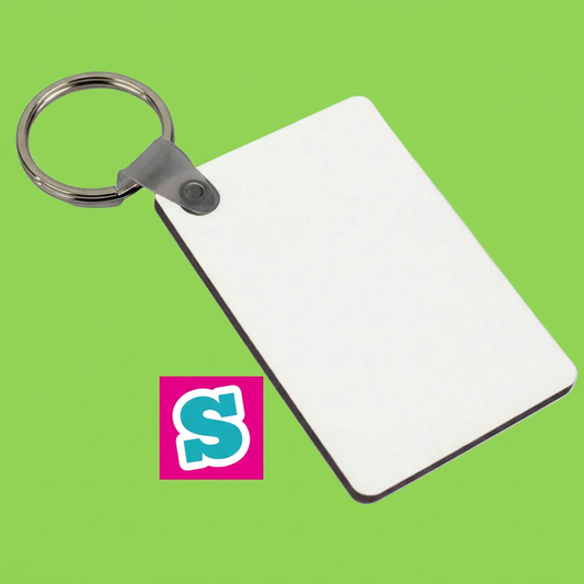 White rectangular double-sided MDF sublimation keyring 6cm x 4cm with metal ring on a square green background