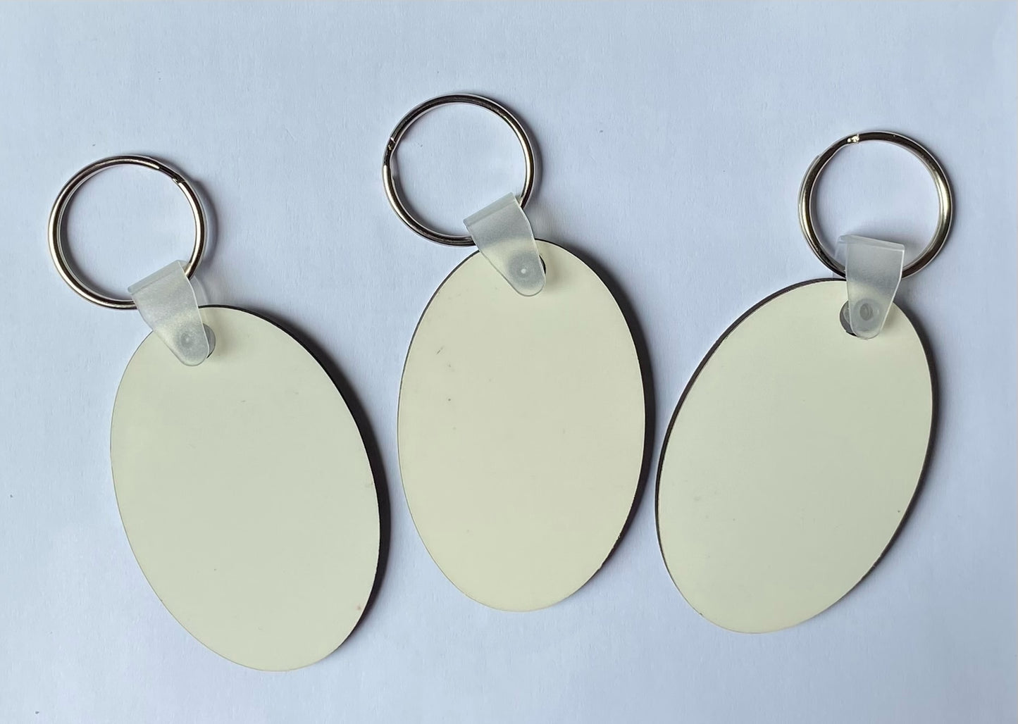 100 x Blank Sublimation MDF Keyrings 6cm x 4cm Double Sided Oval