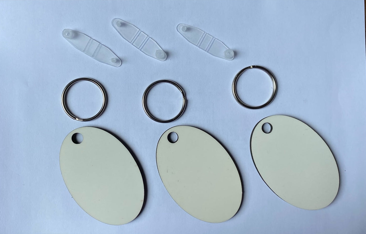 50 x Blank Sublimation MDF Keyrings 6cm x 4cm Double Sided Oval