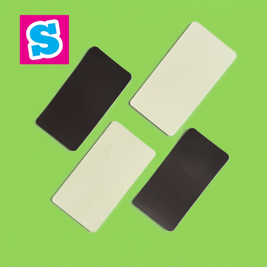 White fronts and dark backs of rectangular polymer sublimation fridge magnets with Sublimania S logo on green background