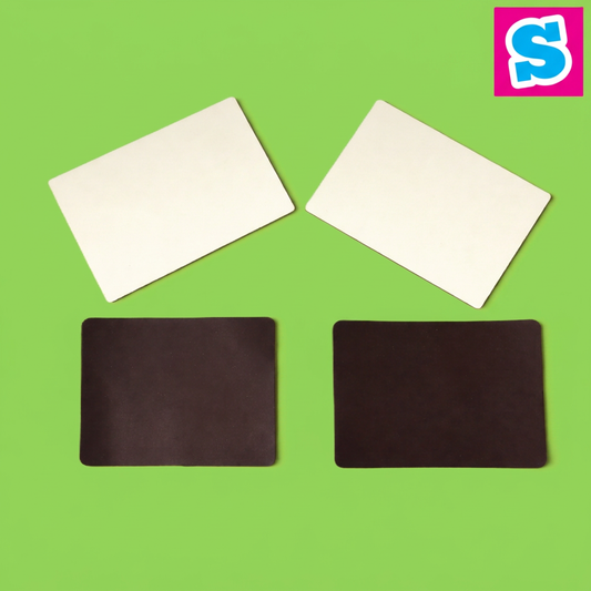 Rectangular MDF sublimation fridge magnets 10cm x 7cm showing white faces and dark backs on a square green background