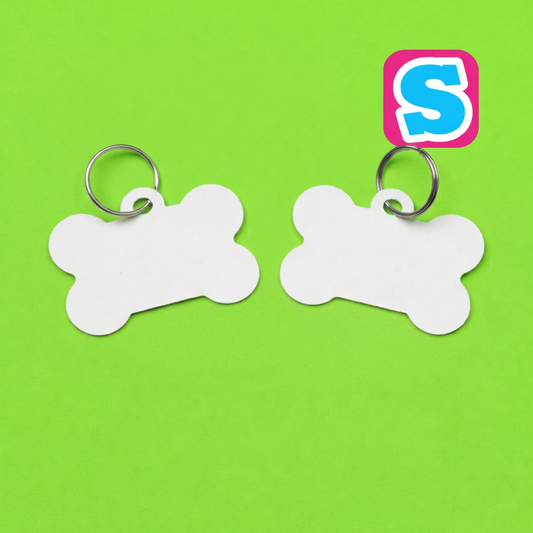 Blank bone-shaped sublimation dog collar tags with metal rings and Sublimania S logo